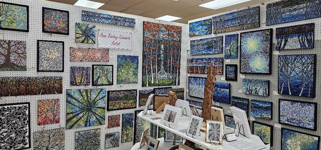 Anne Borbey-Schwartz paintings displayed at Amherst Artisan's Gallery — full booth view